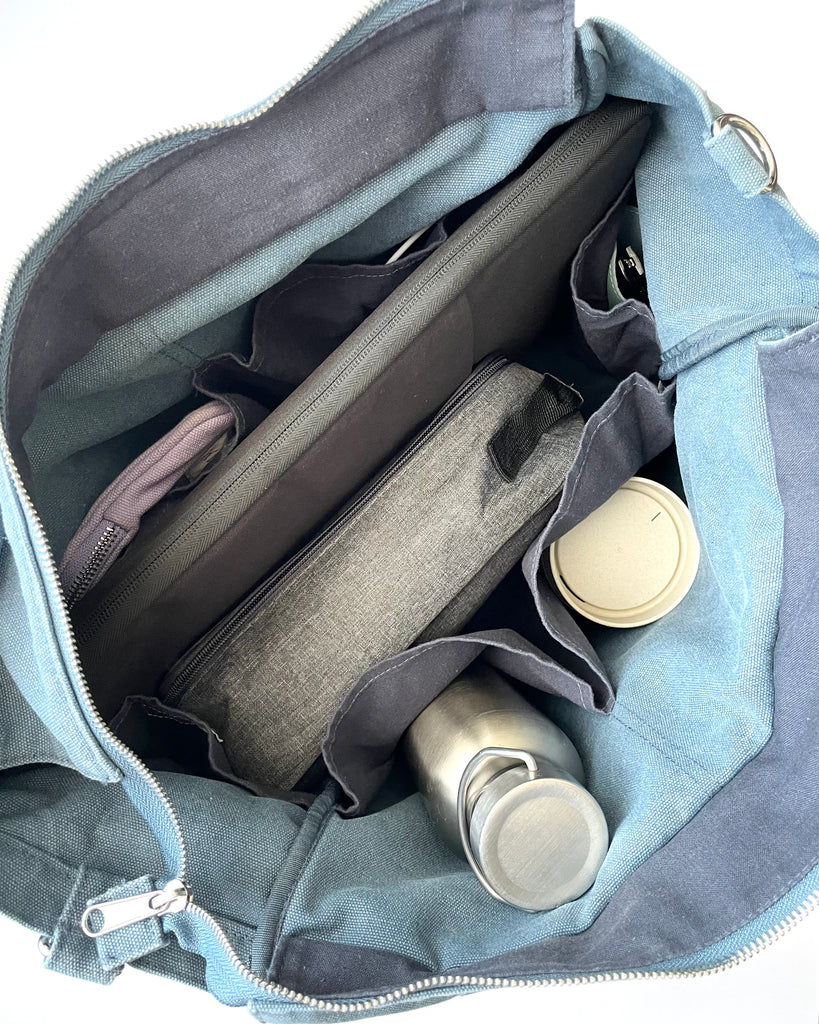 Larger version of the bestselling everyday zip top pocket tote, with six internal pockets, in a versatile and casual style. Large enough to fit a laptop, lunchbag or large water bottle, it makes the perfect bag for work or study, or the ultimate mumbag.