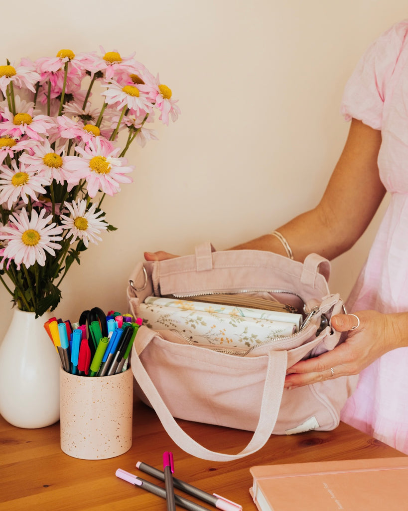 Smaller version of the bestselling everyday zip top pocket tote, with six internal pockets, in a versatile and casual style. The perfect bag for days when you don’t need to carry everything.