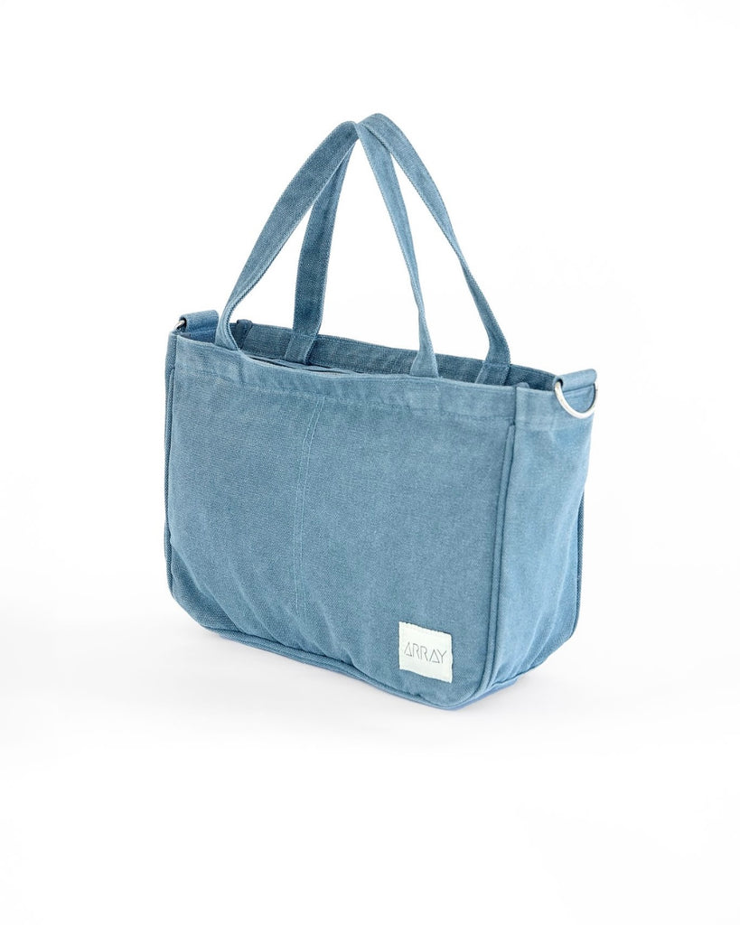 Smaller version of the bestselling everyday zip top pocket tote, with six internal pockets, in a versatile and casual style. The perfect bag for days when you don’t need to carry everything.